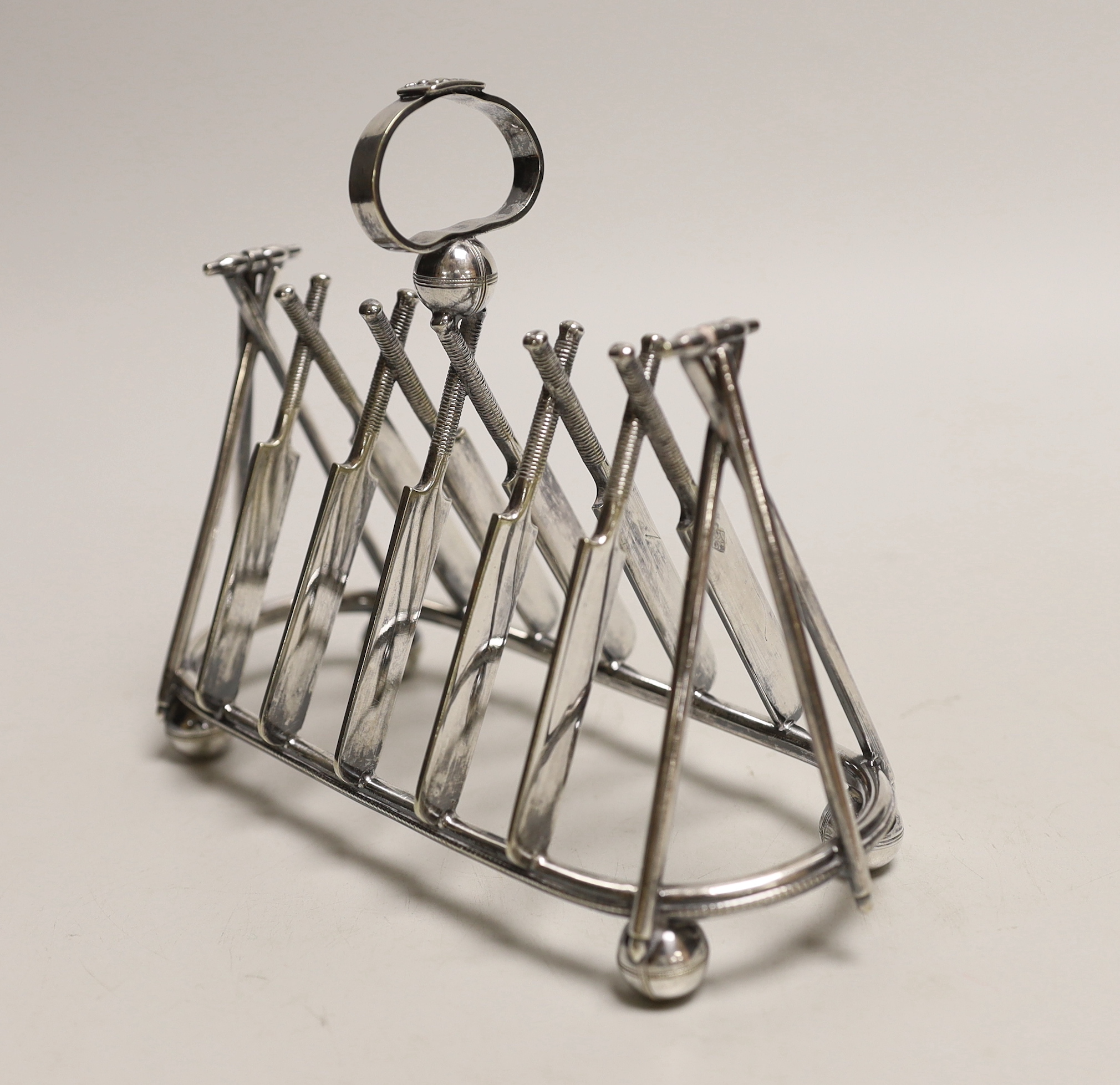 A Victorian EPNS novelty ‘cricket’ toast rack, 18cm wide, 15cm high